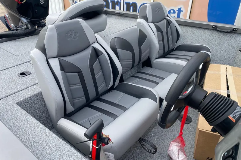 Slide: The Image of 2026 G3 Sportsman 1810 PFX boat interior with stylish gray seating and steering wheel. - 8