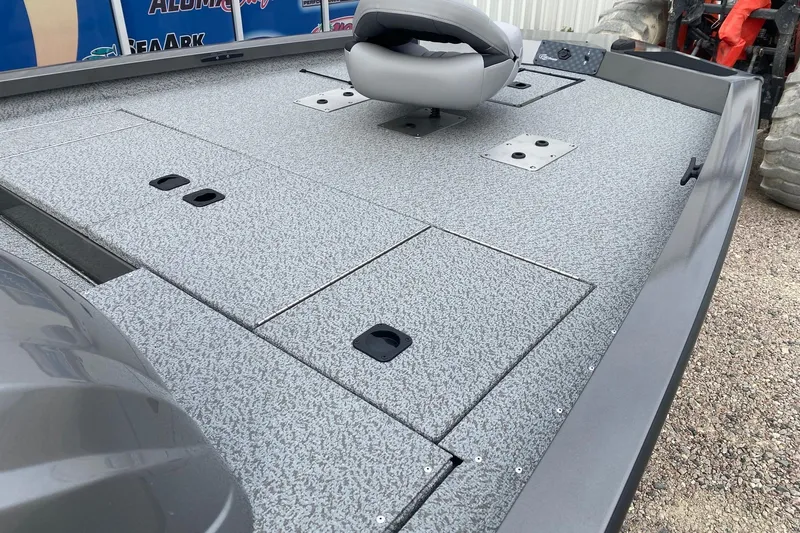 Slide: The Image of 2026 G3 Sportsman 1810 PFX boat deck with seating and storage compartments. - 9