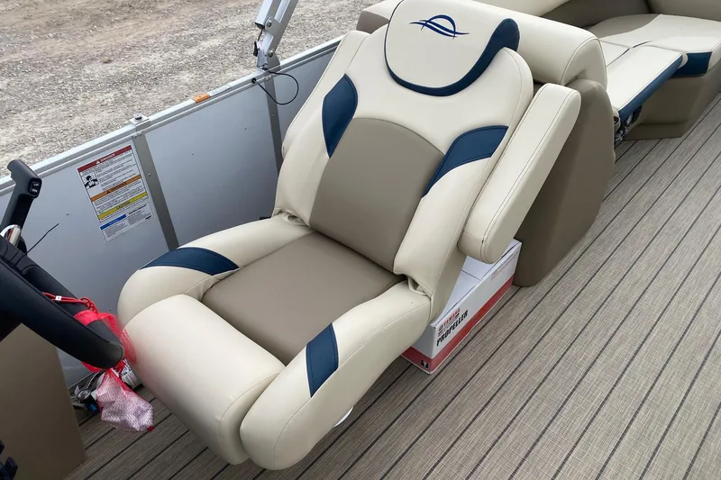 Slide: The Image of Luxurious seating on 2026 SunCatcher Select 322RC boat, featuring beige and blue upholstery. - 8