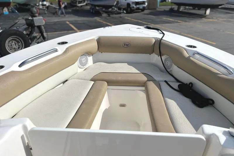 Slide: The Image of 2017 Key West 239 DFS boat interior with beige seating and cup holders. - 8