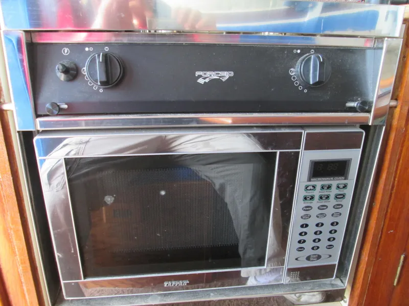 Slide: The Image of Combination oven and microwave in 1966 Grand Banks 32 Sedan. - 11