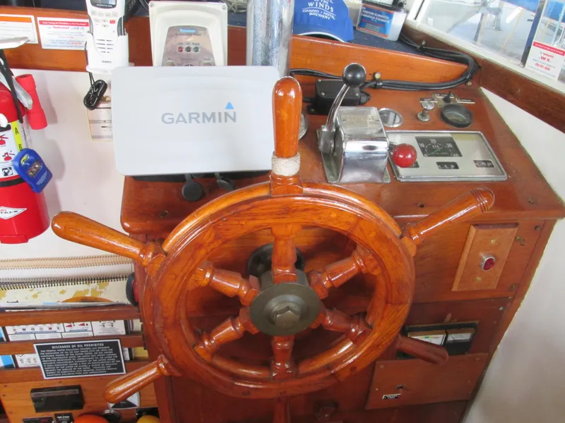 Slide: The Image of 1966 Grand Banks 32 Sedan helm with Garmin navigation system. - 13