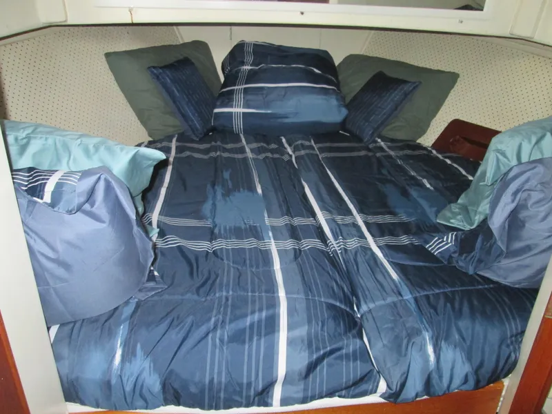 Slide: The Image of Cozy bed in a 1966 Grand Banks 32 Sedan. - 17