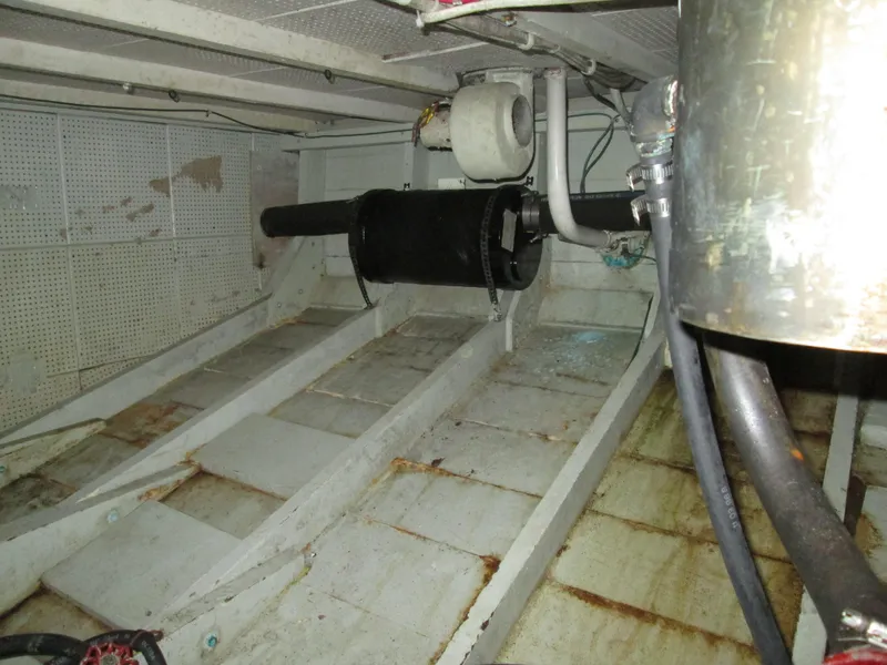 Slide: The Image of Interior of a 1966 Grand Banks 32 Sedan boat, showing engine room. - 25