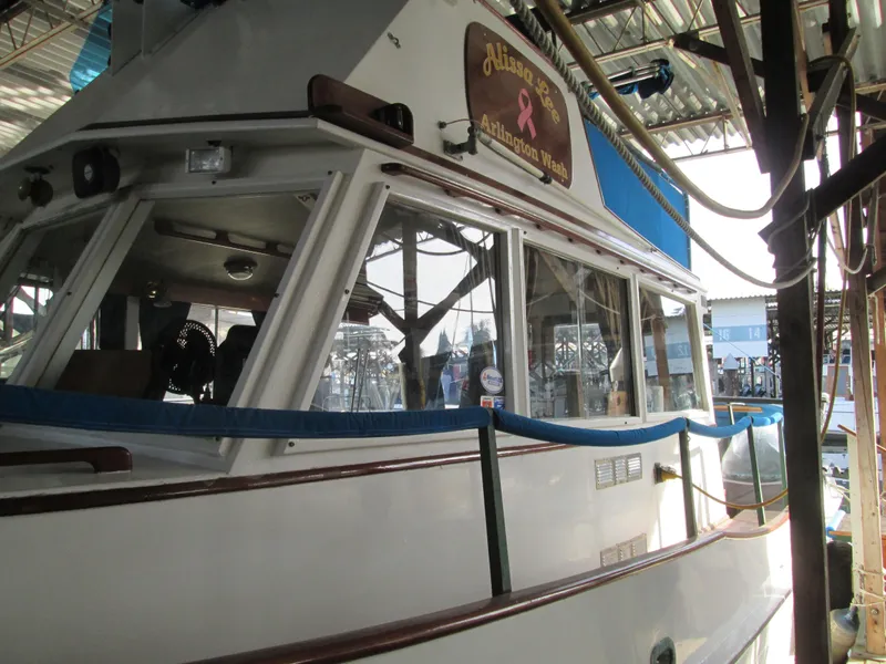 Slide: The Image of 1966 Grand Banks 32 Sedan docked, side view. - 3