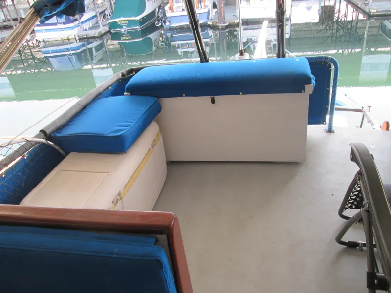 Slide: The Image of 1966 Grand Banks 32 Sedan boat interior with blue seating. - 7