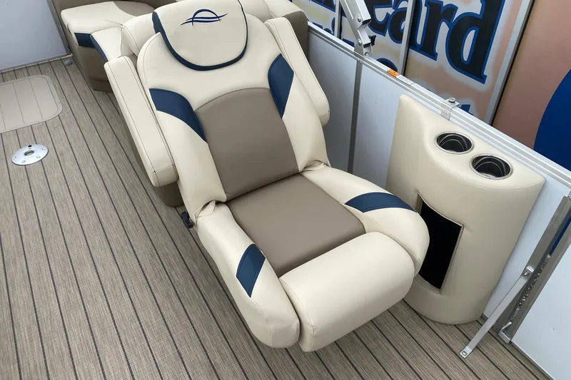 Slide: The Image of Luxurious seating on 2026 SunCatcher Select 322RC boat with cup holders and stylish design. - 8