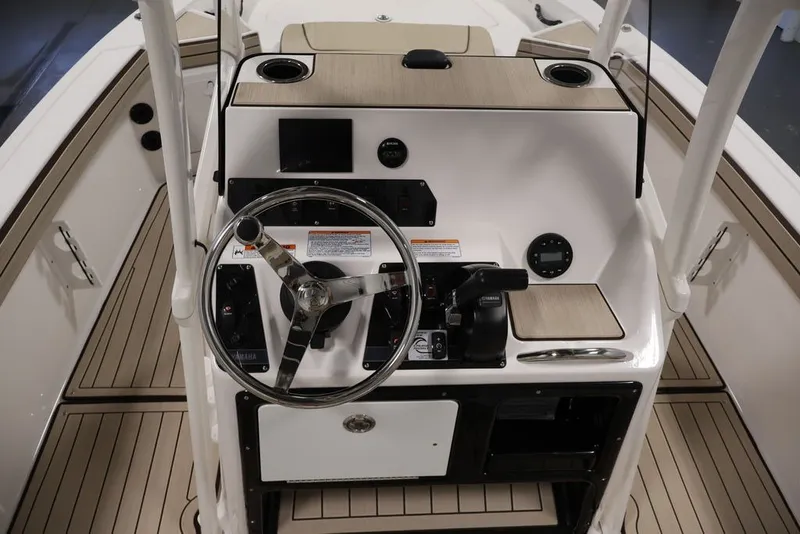 Slide: The Image of 2026 Yamaha Boats 195 FSH Sport dashboard with steering wheel and controls. - 20