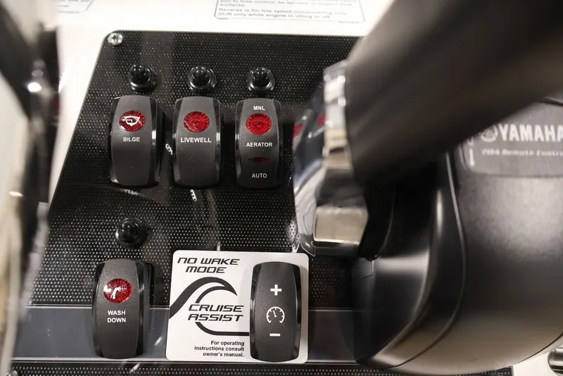Slide: The Image of Control panel of 2026 Yamaha Boats 195 FSH Sport with various switches and cruise assist. - 34