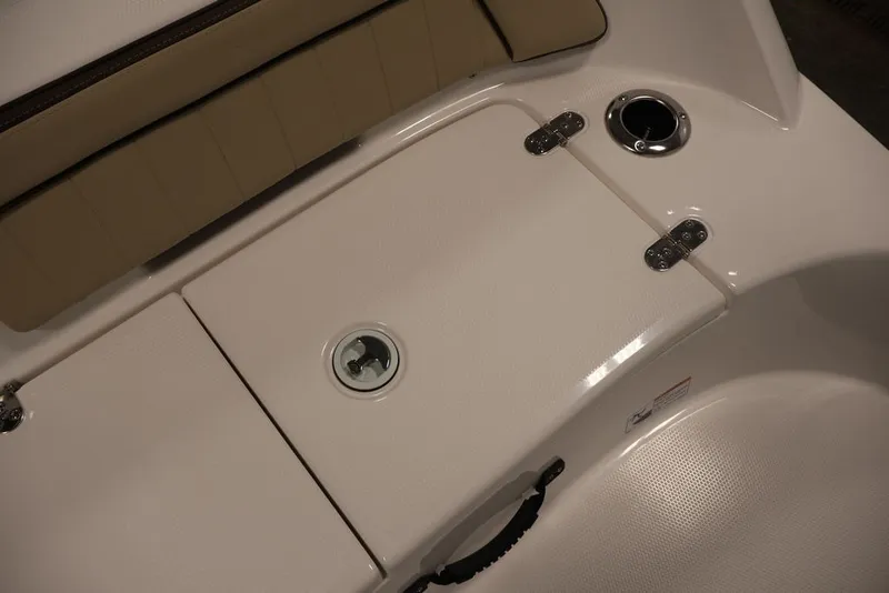 Slide: The Image of 2026 Yamaha Boats 195 FSH Sport deck with storage compartment and seating. - 26