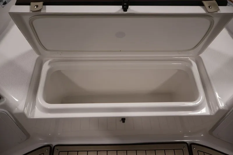 Slide: The Image of Open storage compartment on 2026 Yamaha Boats 195 FSH Sport. - 21