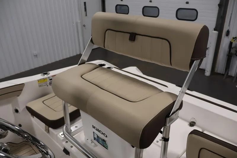 Slide: The Image of 2026 Yamaha Boats 195 FSH Sport interior with beige seating and steering wheel. - 28