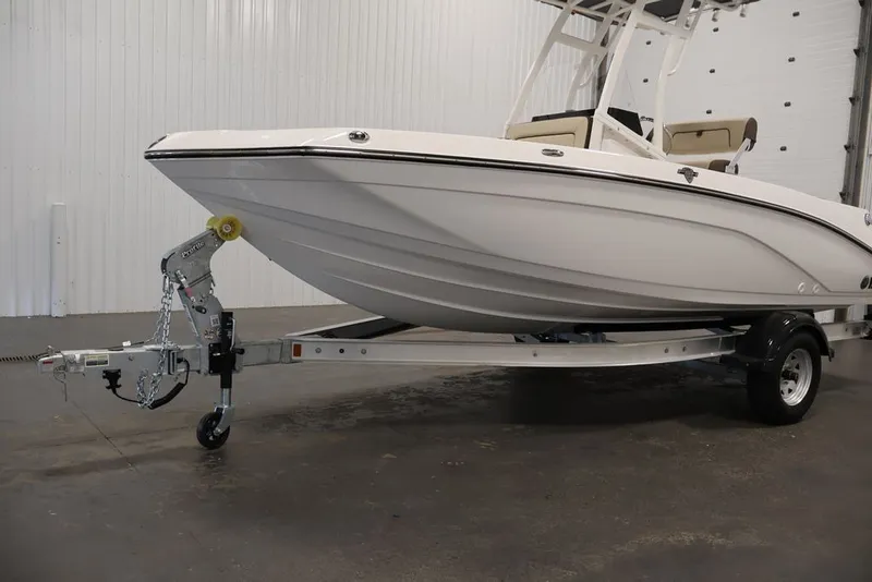 Slide: The Image of 2026 Yamaha Boats 195 FSH Sport on trailer in indoor setting. - 25