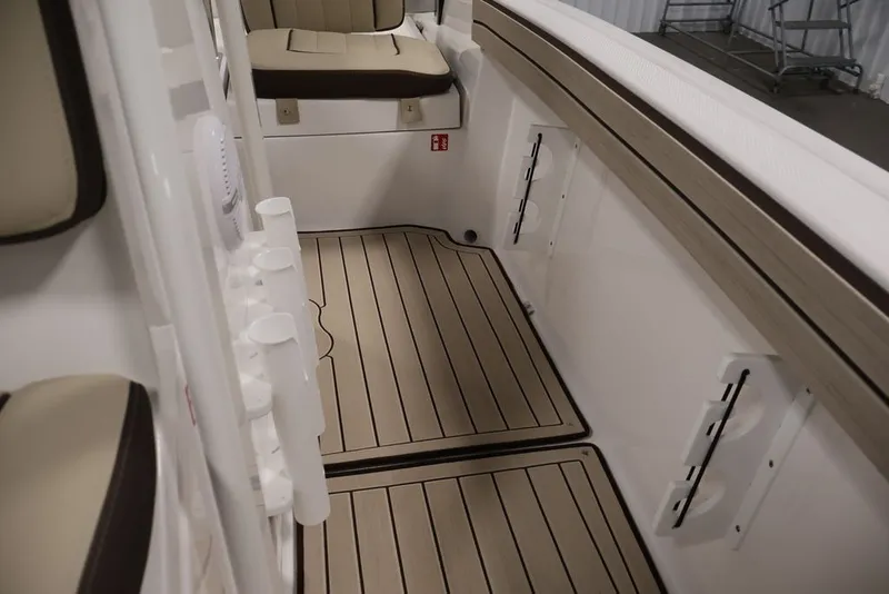 Slide: The Image of Interior view of 2026 Yamaha Boats 195 FSH Sport, featuring sleek seating and flooring. - 38