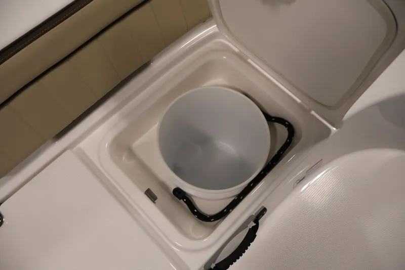 Slide: The Image of Storage compartment with bucket in 2026 Yamaha Boats 195 FSH Sport. - 33
