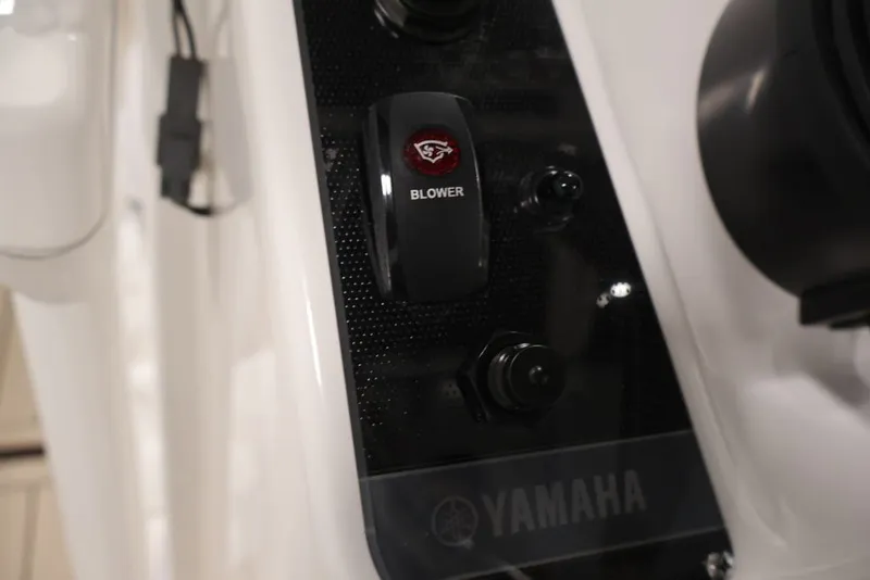 Slide: The Image of Control panel of 2026 Yamaha Boats 195 FSH Sport, featuring blower switch. - 30