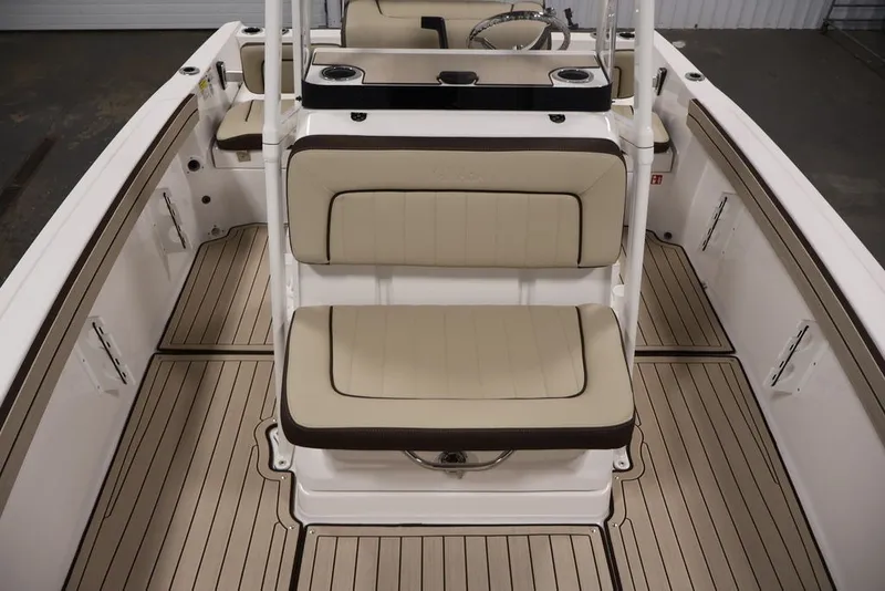 Slide: The Image of 2026 Yamaha Boats 195 FSH Sport interior with beige seating and sleek design. - 19