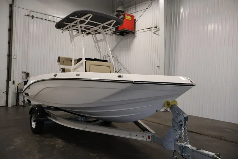 Slide: The Image of 2026 Yamaha Boats 195 FSH Sport in a showroom, featuring sleek design and modern amenities. - 4