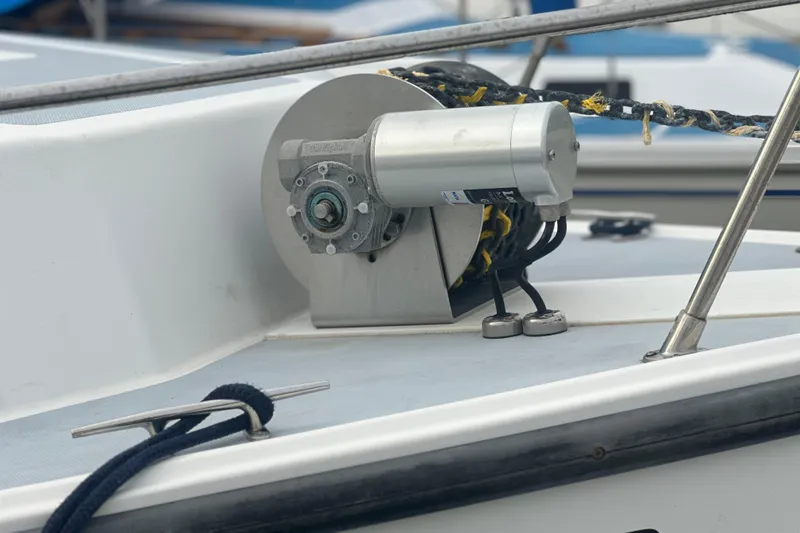 Slide: The Image of Anchor winch on 1999 Samson East Coast Lobster boat deck with coiled rope. - 13