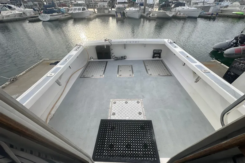 Slide: The Image of Open deck of a 1999 Samson East Coast Lobster boat in a marina. - 2