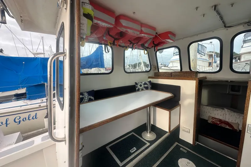 Slide: The Image of Interior of 1999 Samson East Coast Lobster boat with seating and life jackets. - 7