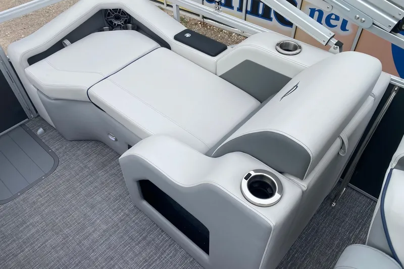 Slide: The Image of 2026 SunCatcher Diamond Elite 324 SS boat interior with luxurious seating and cup holders. - 10