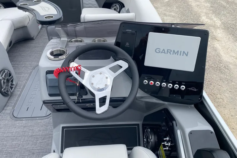 Slide: The Image of 2026 SunCatcher Diamond Elite 324 SS boat dashboard with Garmin navigation system. - 11