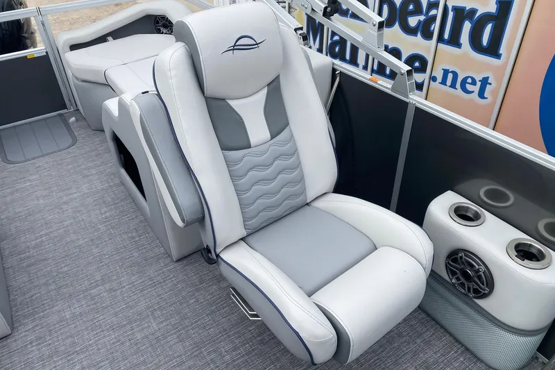Slide: The Image of Luxurious seating on 2026 SunCatcher Diamond Elite 324 SS pontoon boat, featuring cup holders and speaker. - 8