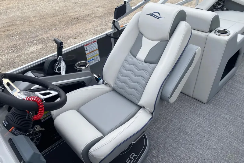 Slide: The Image of 2026 SunCatcher Diamond Elite 324 SS boat interior with luxurious captain's chair and steering console. - 9