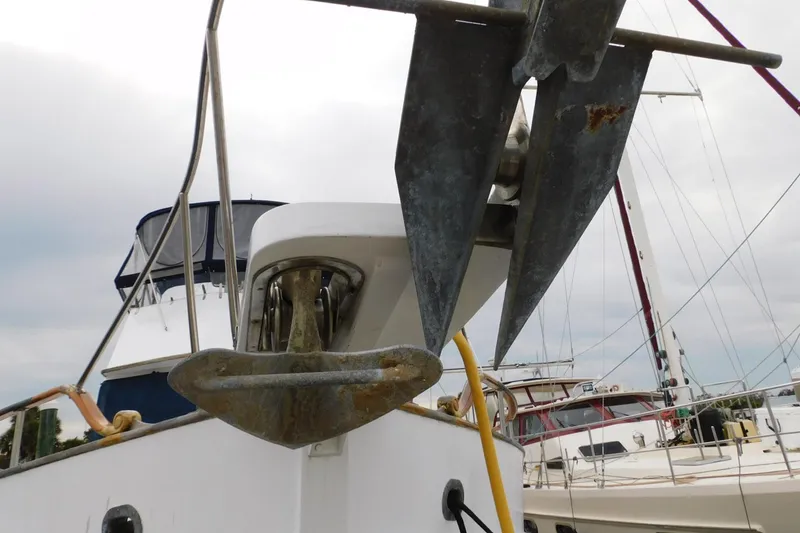 Slide: The Image of Bow view of 1986 Grand Banks 46 Classic yacht with anchor detail. - 18