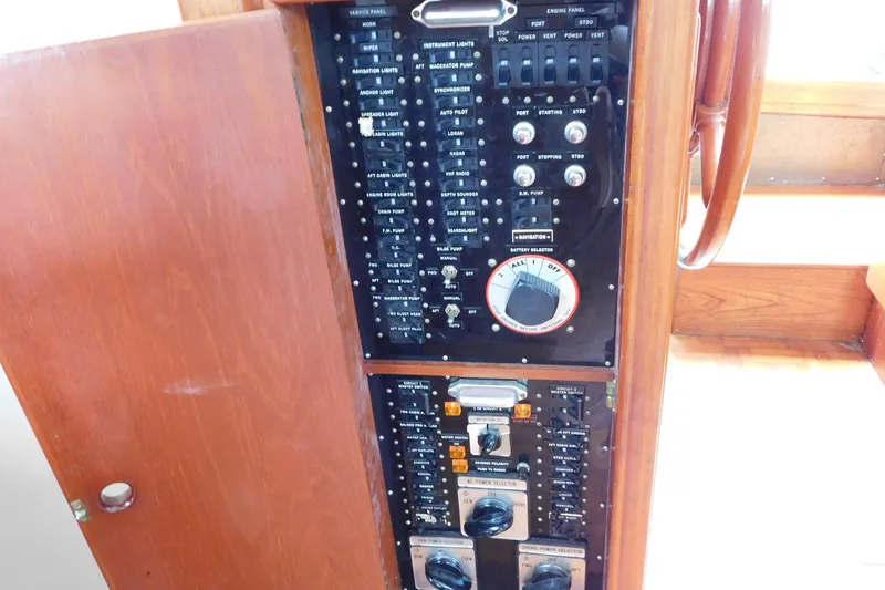 Slide: The Image of Electrical control panel on 1986 Grand Banks 46 Classic yacht, featuring various switches and dials. - 7