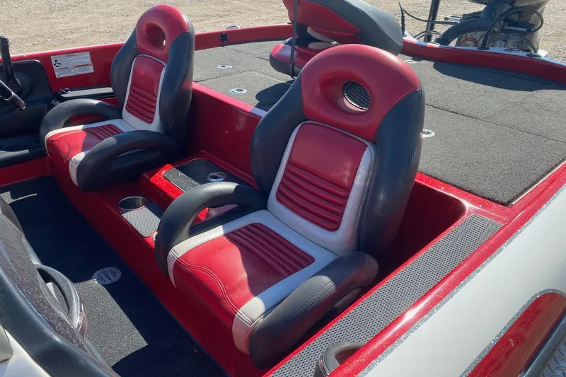 Slide: The Image of Red and black interior of 2018 Blazer 625 Pro Elite boat with cushioned seats. - 10