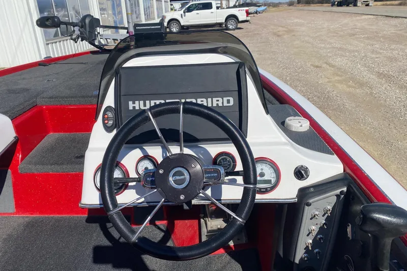Slide: The Image of 2018 Blazer 625 Pro Elite boat dashboard with steering wheel and Humminbird display. - 7