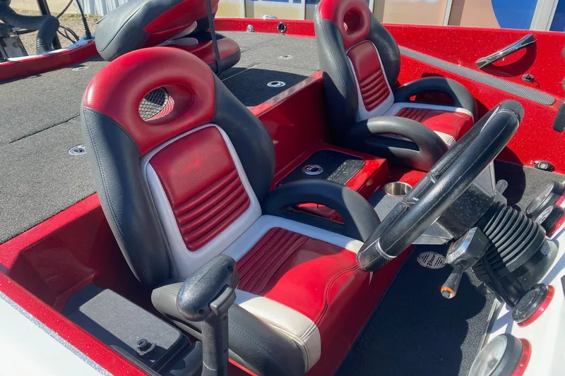 Slide: The Image of 2018 Blazer 625 Pro Elite boat interior with red and black seating. - 8