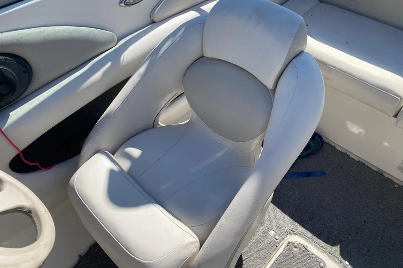 Slide: The Image of 2007 Chaparral 190 SSi boat interior with white cushioned seat and speaker. - 10