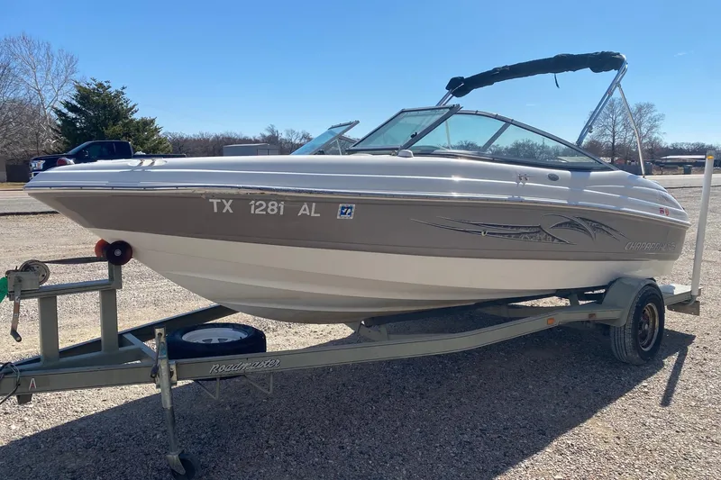Slide: The Image of 2007 Chaparral 190 SSi boat on trailer, parked outdoors under clear sky. - 3