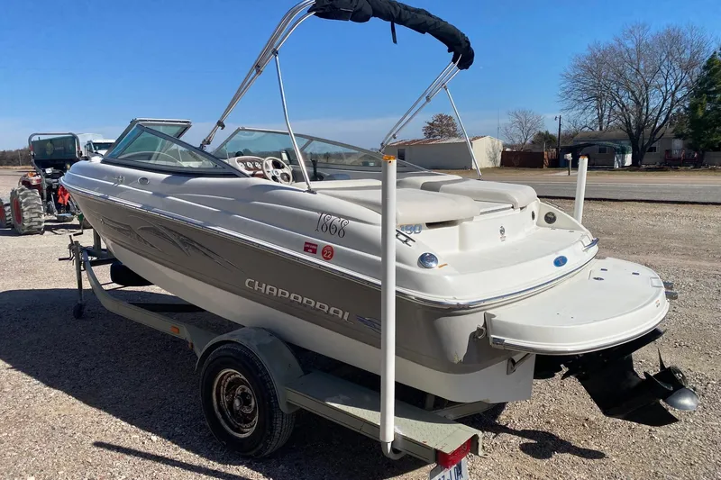Slide: The Image of 2007 Chaparral 190 SSi boat on trailer, parked outdoors on gravel. - 4
