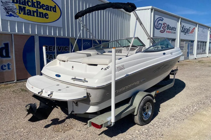 Slide: The Image of 2007 Chaparral 190 SSi boat on trailer outside marine dealership. - 6