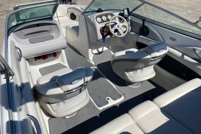 Slide: The Image of 2007 Chaparral 190 SSi boat interior with steering wheel, seating, and dashboard controls. - 7
