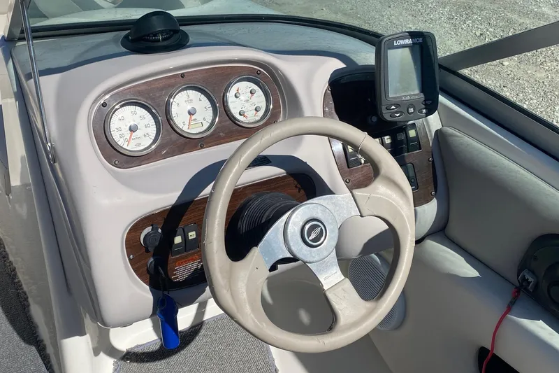 Slide: The Image of 2007 Chaparral 190 SSi boat dashboard with steering wheel and gauges. - 8