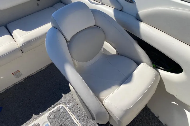 Slide: The Image of 2007 Chaparral 190 SSi boat interior with white cushioned seating. - 9
