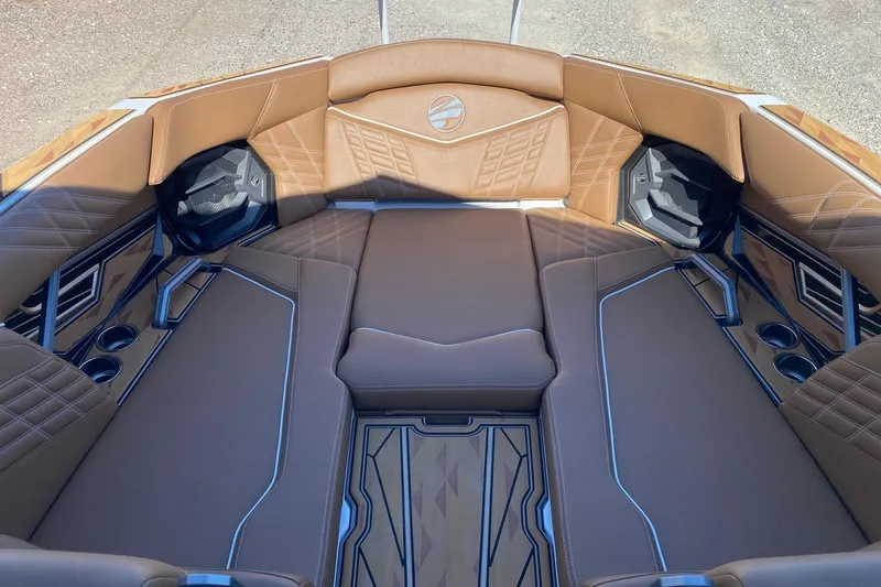 Slide: The Image of Luxurious interior of 2025 Tigé Ultré 25ZX boat with brown leather seating. - 10
