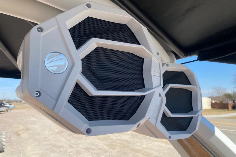 Slide: The Image of 2025 Tigé Ultré 25ZX boat speakers, hexagonal design, mounted outdoors under clear sky. - 13