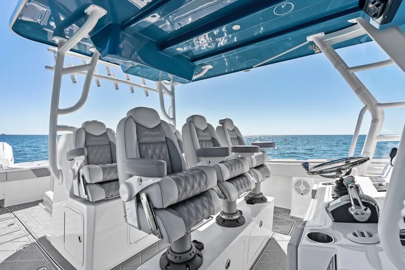 Slide: The Image of Luxurious interior of 2024 Invincible 46 Catamaran with plush seating and ocean view. - 13