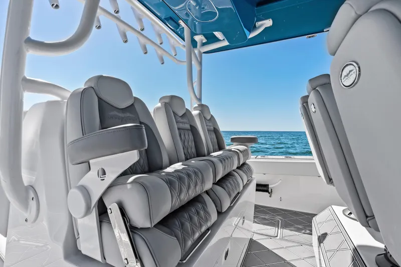 Slide: The Image of Luxury seating on 2024 Invincible 46 Catamaran, ocean view in background. - 15