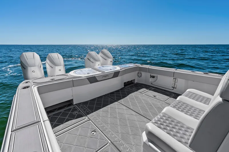 Slide: The Image of 2024 Invincible 46 Catamaran with quad engines, spacious deck, and ocean view. - 20