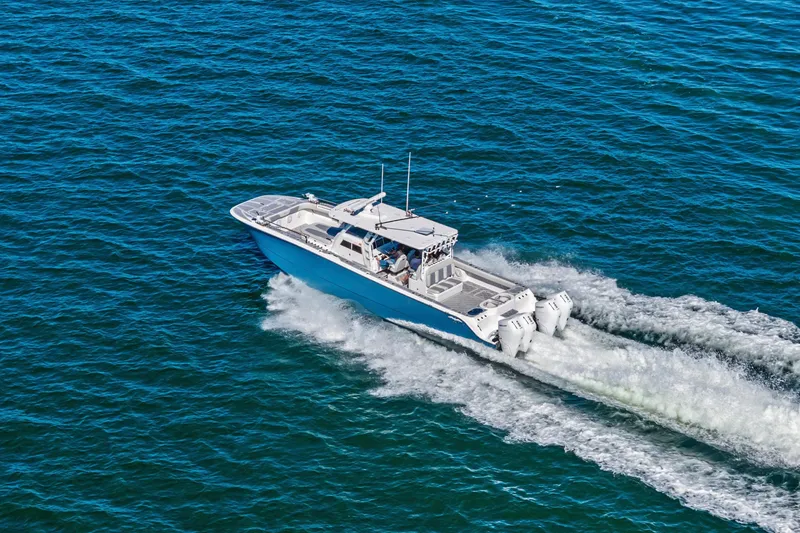 Slide: The Image of 2024 Invincible 46 Catamaran cruising on open blue water. - 4