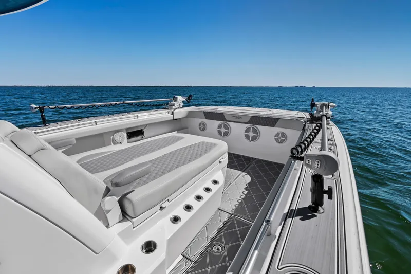 Slide: The Image of 2024 Invincible 46 Catamaran interior with seating, ocean view, and clear blue sky. - 8