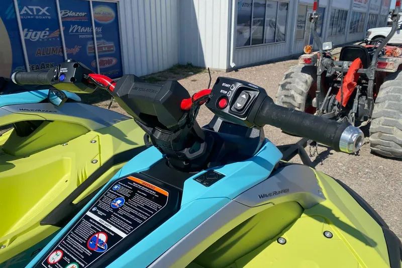 Slide: The Image of 2025 Yamaha WaveRunner JetBlaster handlebars and controls, vibrant colors, outdoor setting. - 8
