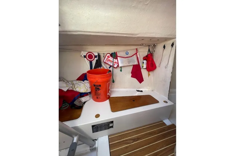 Slide: The Image of Interior of 1997 Beneteau 25 Platu sailboat with storage and equipment. - 8